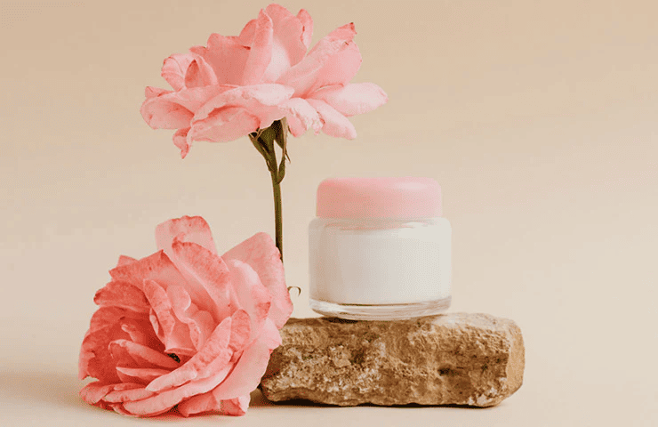 Skincare products and pink flowers